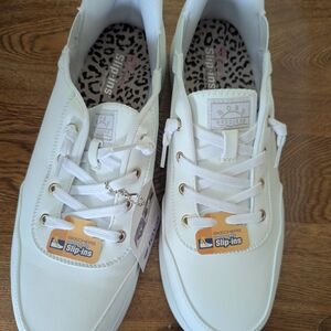 Skechers Women's White Slip-Ins with Gold Accents